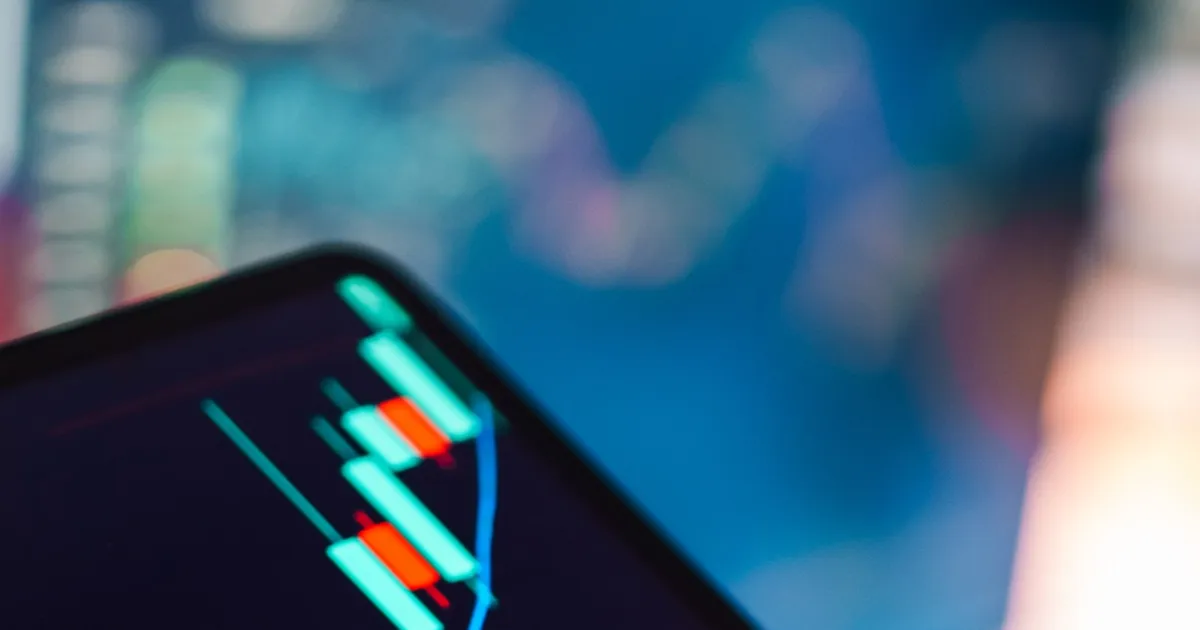 A close-up of a stock price candlestick chart