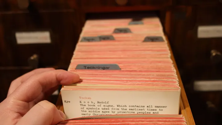 A library card catalog drawer, representing indexed lookup