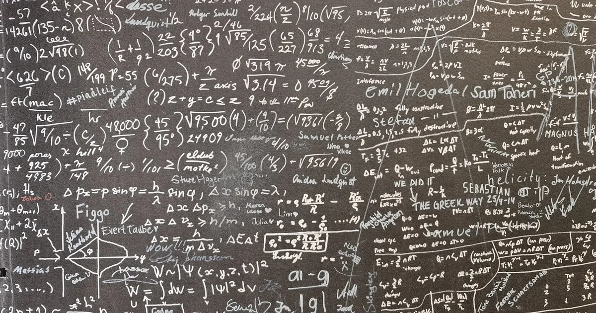 Diagrams and equations on a chalkboard