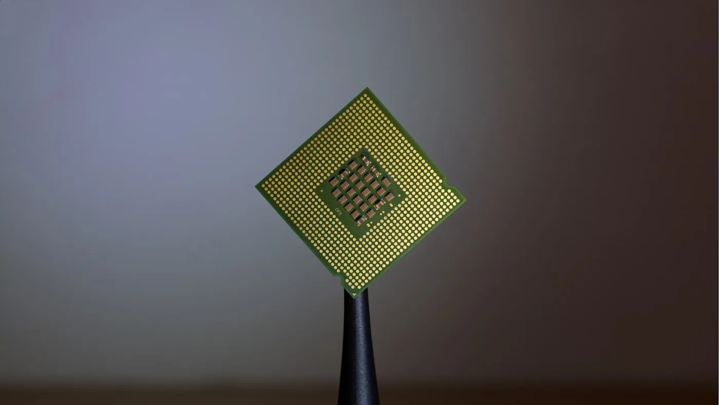 A single semiconductor chip balanced on a fingertip