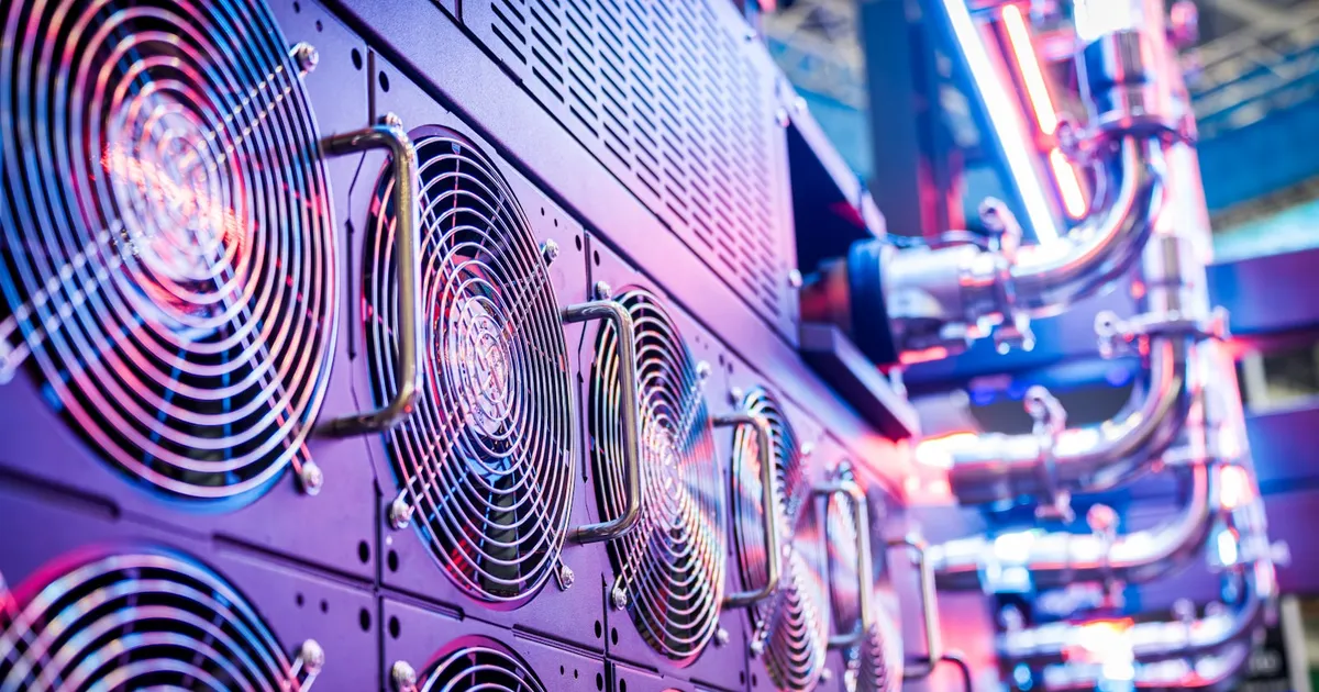 Rows of glowing cooling fans inside an AI data center
