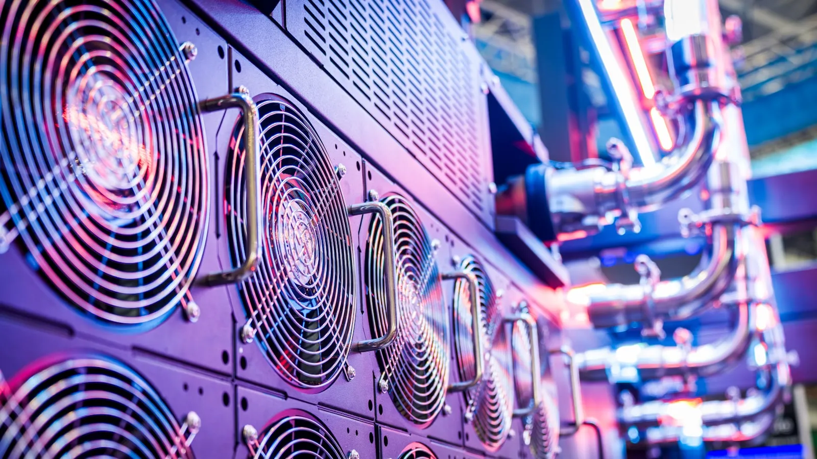 Close-up of cooling fans in a dense row of data center servers