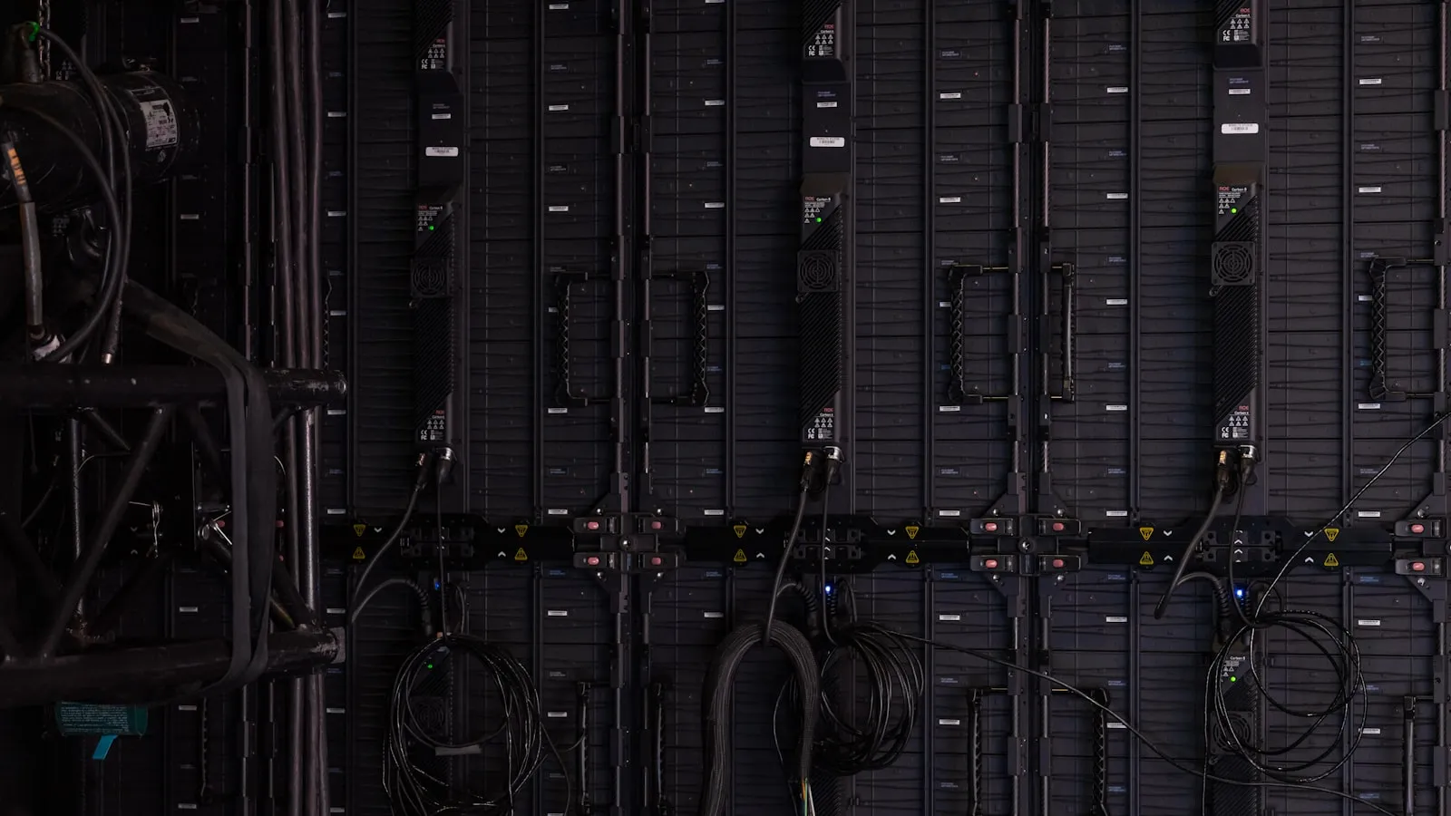 Rows of illuminated server racks inside a data center