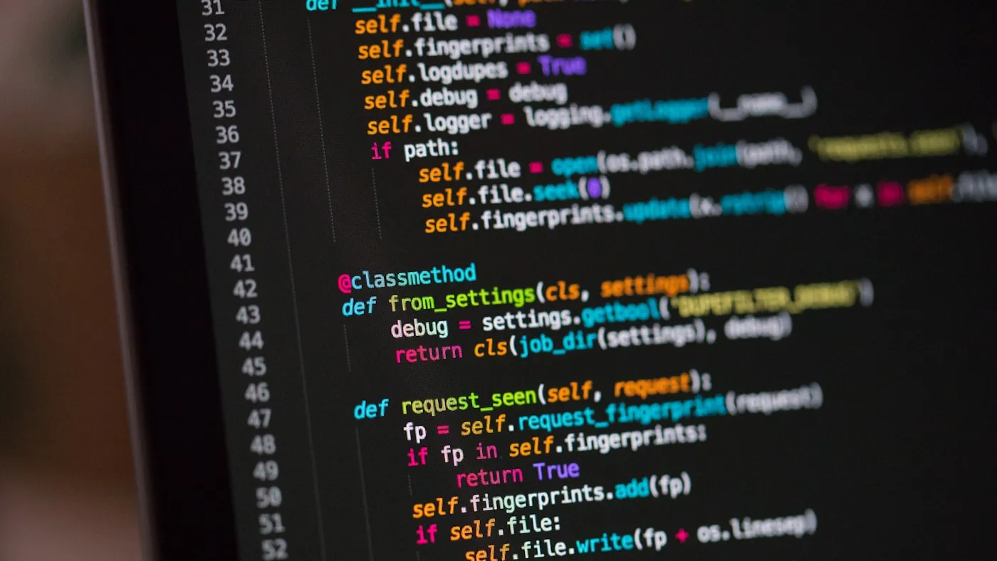 Colorful source code on a dark editor screen