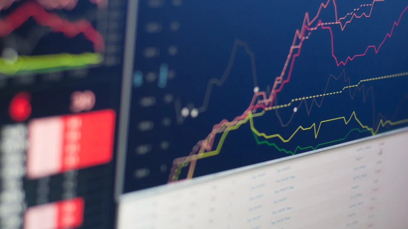 A stock-market board showing multiple price charts