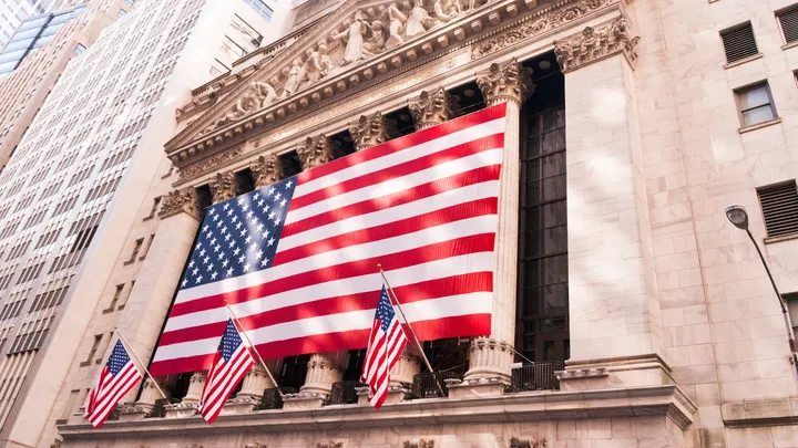 The New York Stock Exchange draped with a large American flag