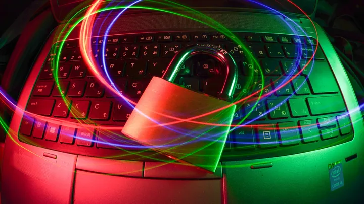 Light trails streaking past a padlock, representing actively exploited network vulnerabilities in AI infrastructure