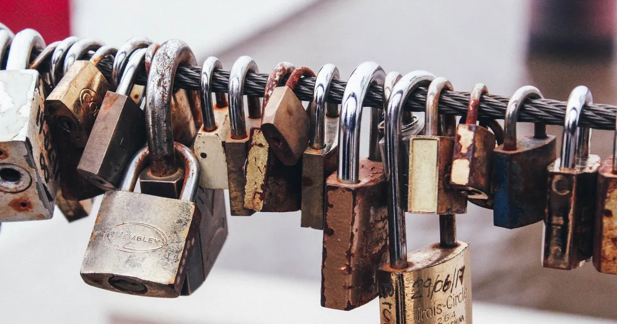 Padlocks strung along a cable