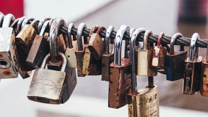 Padlocks clipped onto a network cable, representing edge-device security
